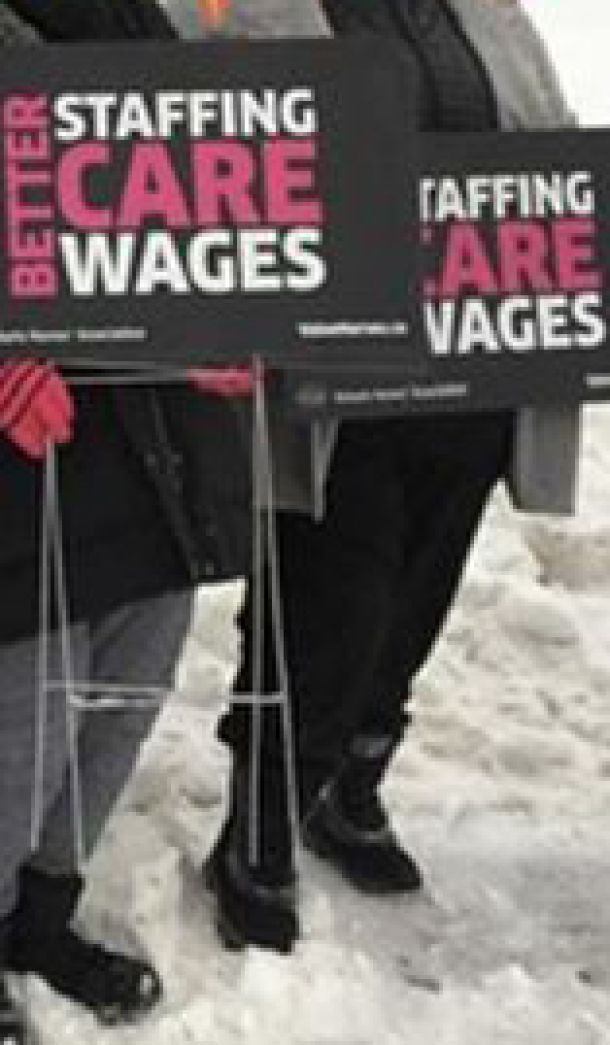 Picketing for better wages and staffing